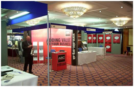 Shell Schemes By Exhibit World, a picture of a red shells stand at an exhibition